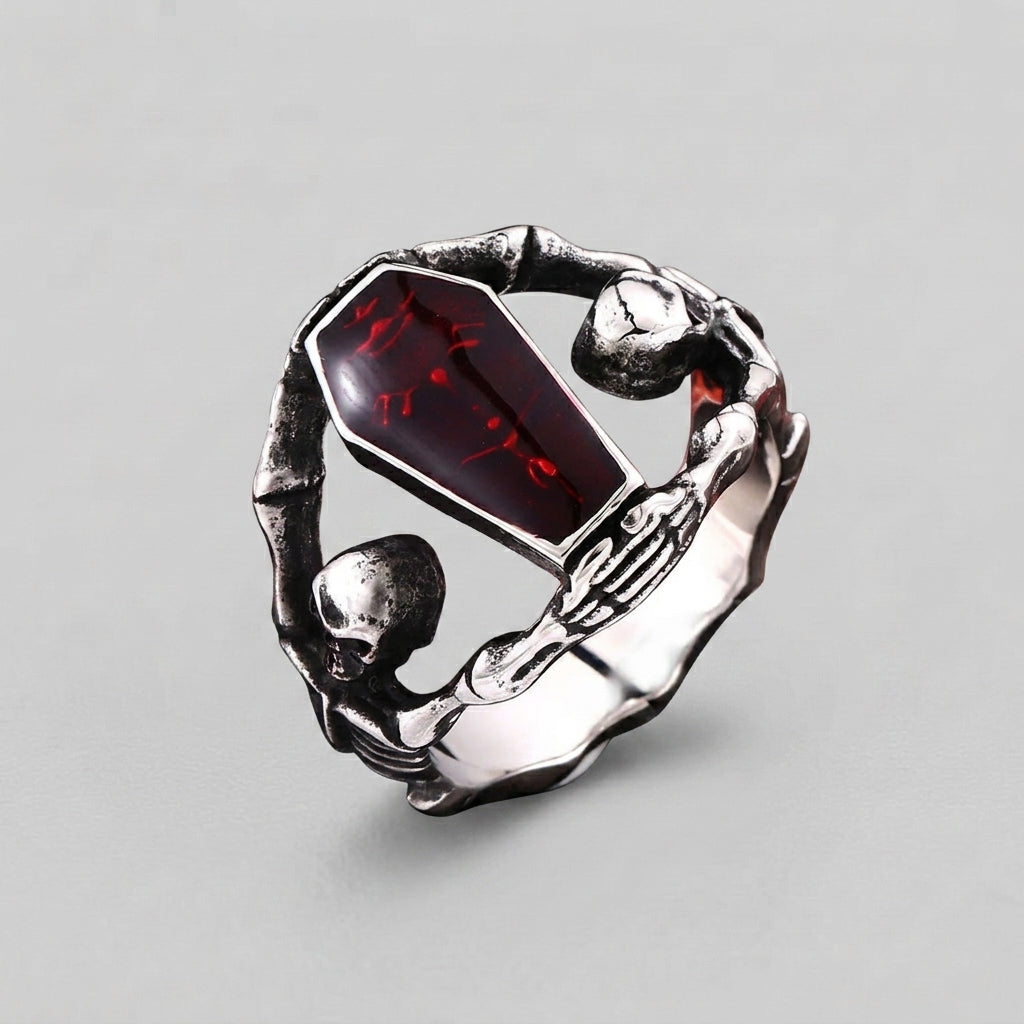 Sarg-Stein-Ring mit Skeletthand und Totenkopf-Details